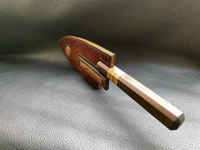 Load image into Gallery viewer, Hand dyed sunburst tan to brown Leather outer with Ostrich skin inlays and blue layers with a unique magnet securing mechanism. Fully handmade leather knife sheath which is completely hand stitched and hand finished to ensure the knife within is protected from the elements. We can design to our customer specifications to ensure you get a truly unique and bespoke item.www.leathercompositions.com