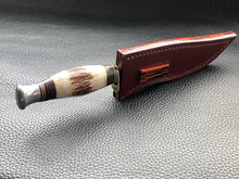 Load image into Gallery viewer, Full English bridle leather with unique welt made from multiple layers of leather to give a unique look. Handmade leather knife sheath which is fully hand stitched and hand finished to ensure the knife within is protected from the elements. We can design to our customer specifications to ensure you get a truly unique and bespoke item. www.leathercompositions.com