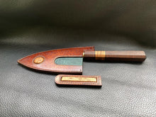 Load image into Gallery viewer, Hand dyed sunburst tan to brown Leather outer with Ostrich skin inlays and blue layers with a unique magnet securing mechanism. Fully handmade leather knife sheath which is completely hand stitched and hand finished to ensure the knife within is protected from the elements. We can design to our customer specifications to ensure you get a truly unique and bespoke item.www.leathercompositions.com