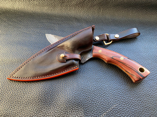 Wet molded leather which is hand dyed and hand finished to the highest standards. Handmade leather knife sheath which is fully hand stitched and hand finished to ensure the knife within is protected from the elements. We can design to our customer specifications to ensure you get a truly unique and bespoke item. www.leathercompositions.com