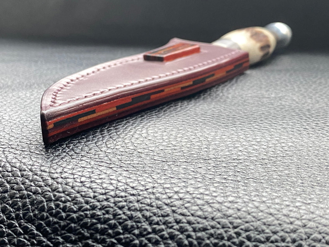 Full English bridle leather with unique welt made from multiple layers of leather to give a unique look. Handmade leather knife sheath which is fully hand stitched and hand finished to ensure the knife within is protected from the elements. We can design to our customer specifications to ensure you get a truly unique and bespoke item. www.leathercompositions.com