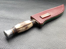 Load image into Gallery viewer, Full English bridle leather with unique welt made from multiple layers of leather to give a unique look. Handmade leather knife sheath which is fully hand stitched and hand finished to ensure the knife within is protected from the elements. We can design to our customer specifications to ensure you get a truly unique and bespoke item. www.leathercompositions.com
