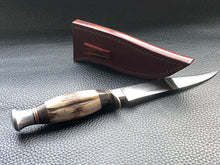 Load image into Gallery viewer, Full English bridle leather with unique welt made from multiple layers of leather to give a unique look. Handmade leather knife sheath which is fully hand stitched and hand finished to ensure the knife within is protected from the elements. We can design to our customer specifications to ensure you get a truly unique and bespoke item. www.leathercompositions.com
